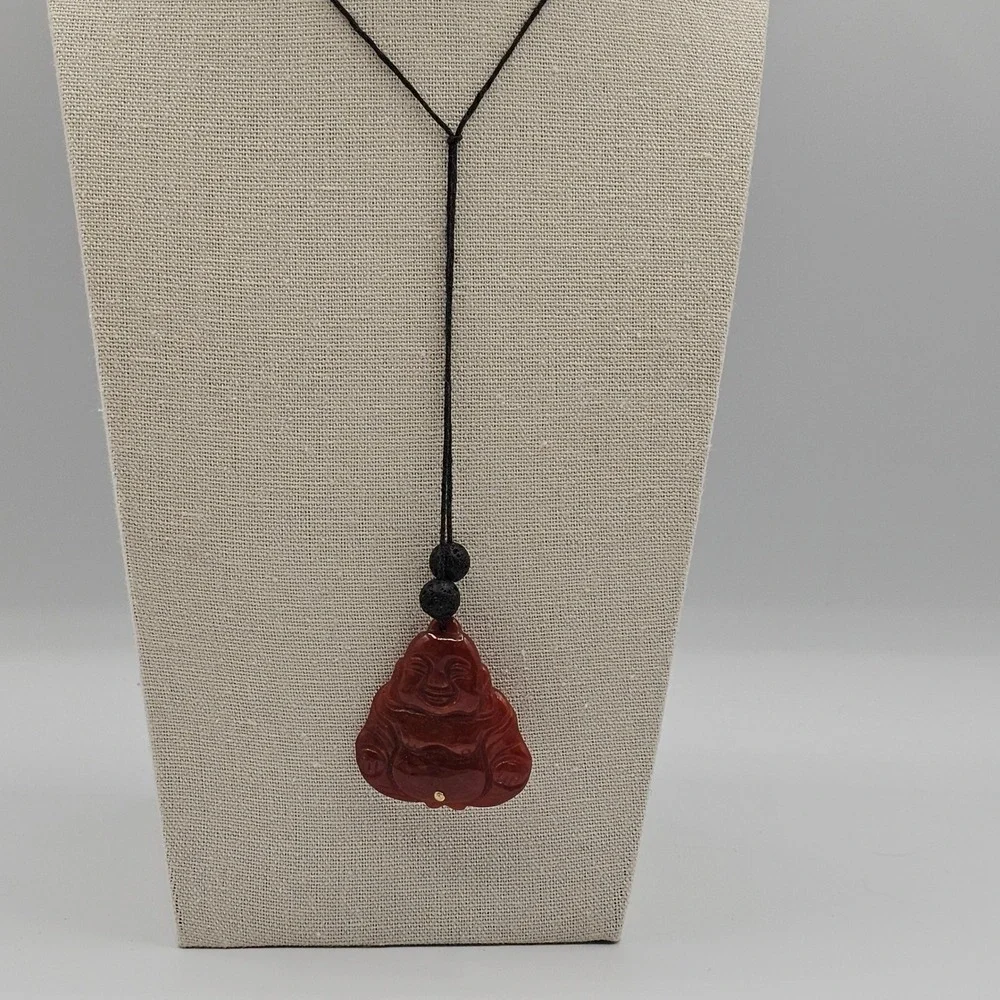 Carved Red Stone Laughing Buddha Pendant Black Cord Necklace Gold Tone Accent
